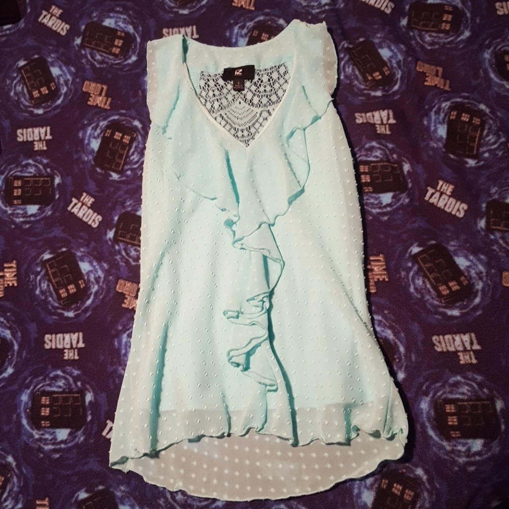 Sleeveless seafoam green blouse